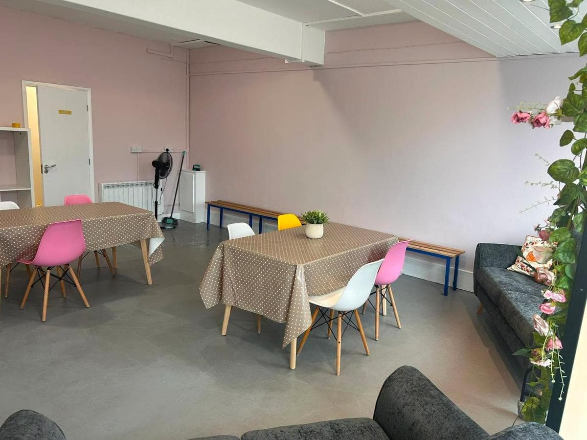 The pink-walled waiting area