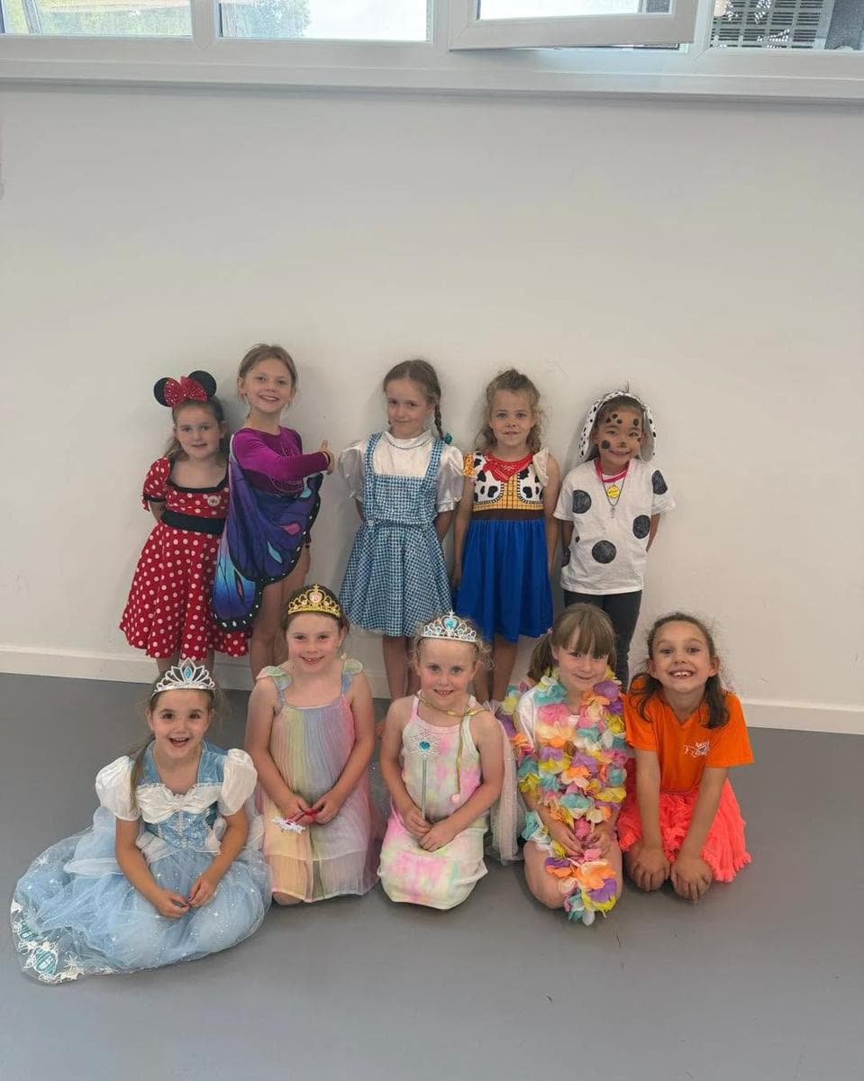 Young pupils in Disney princess costumes at camp