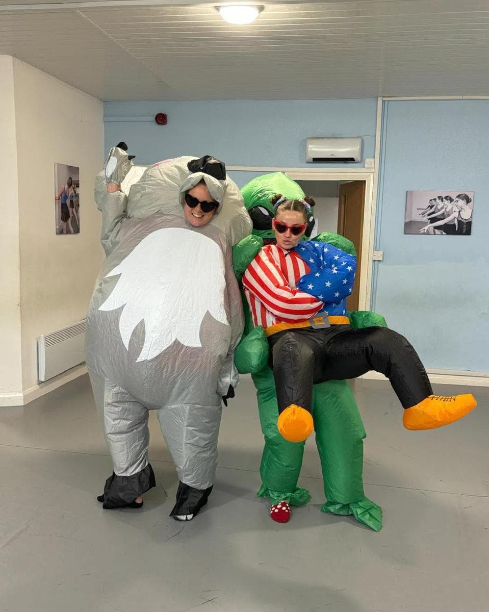 Two teachers in inflatable costumes at camp