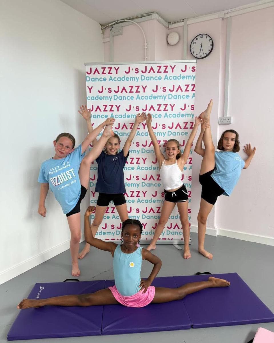 Pupils showing off kicks, splits and balances