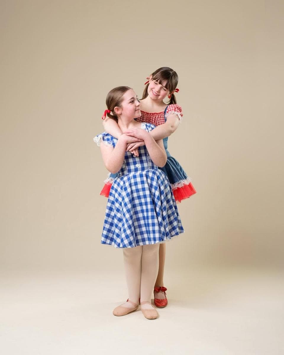 The two Dorothys in gingham dresses