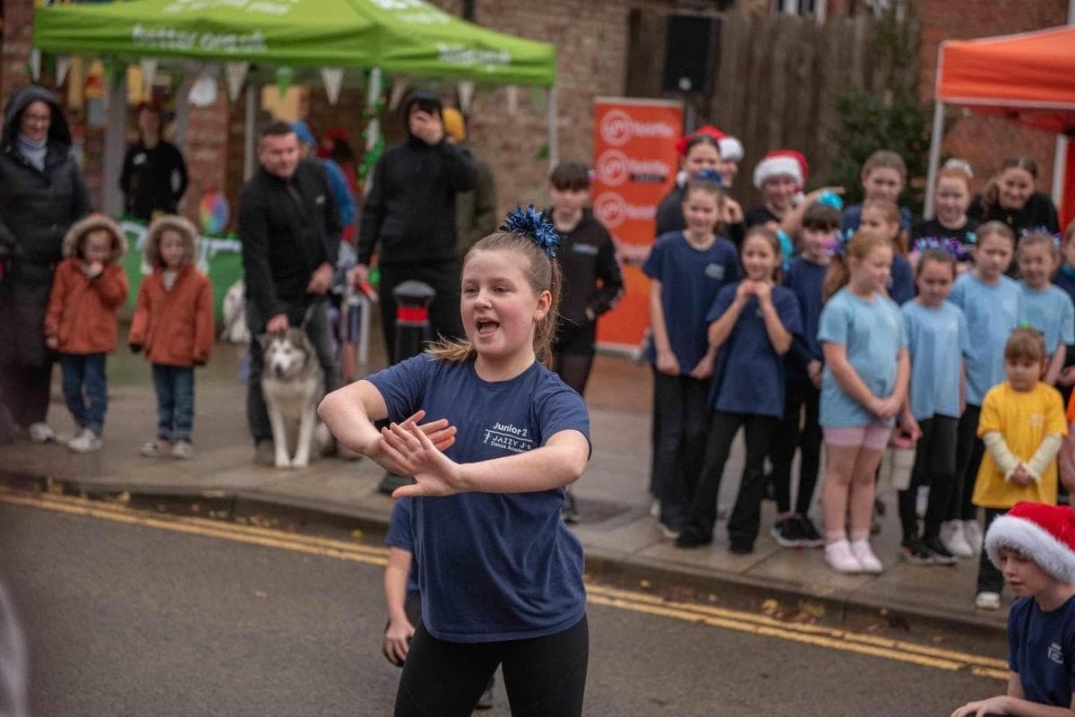 A pupil performing in front of the crowd