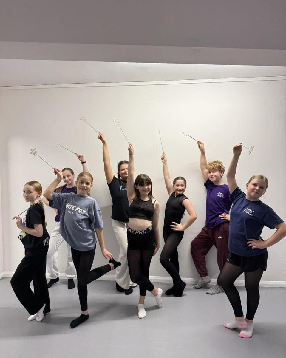 A group striking a pose in the studio