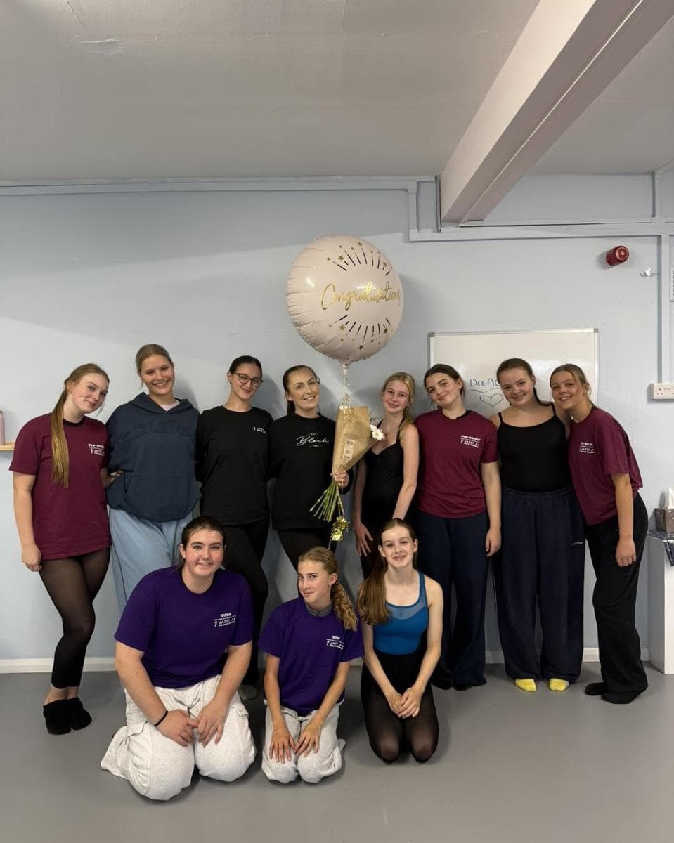 The teaching team with a balloon