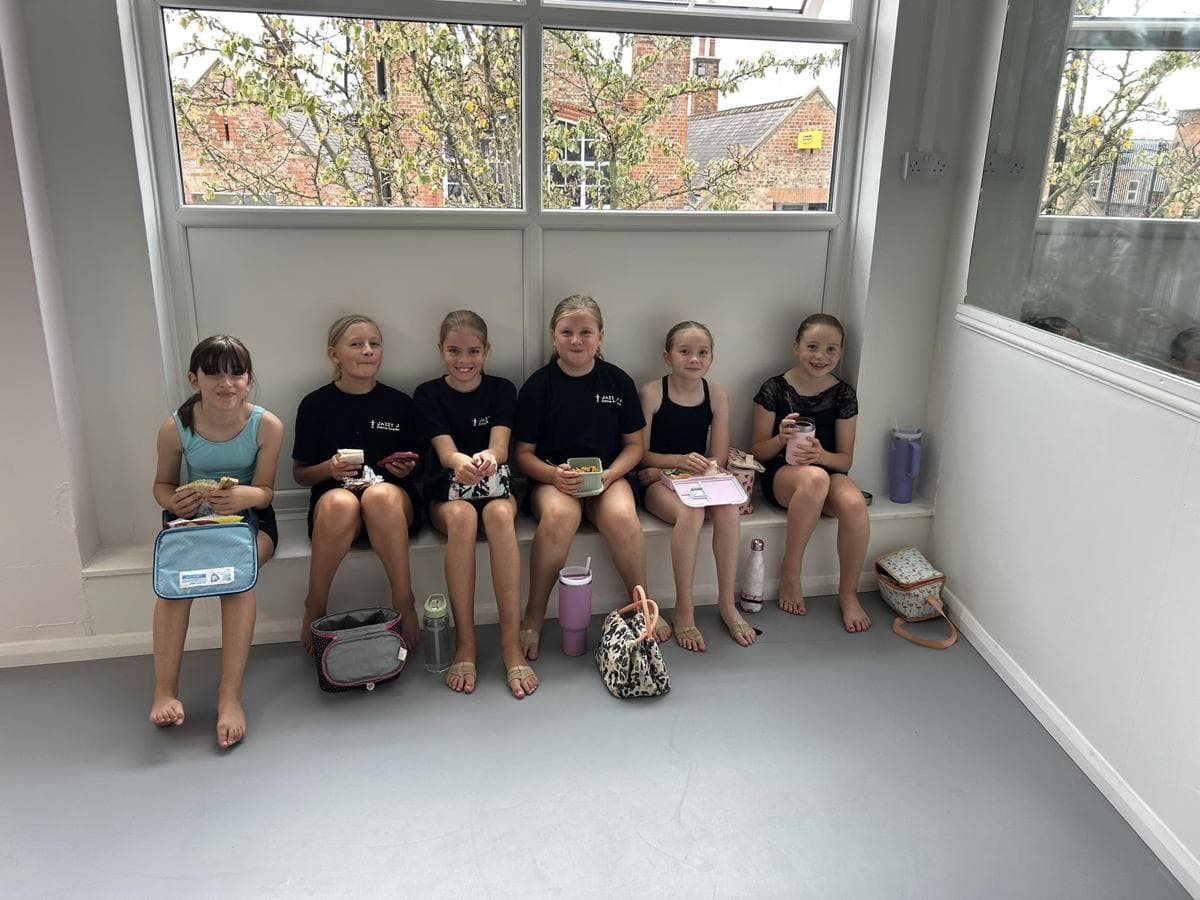 Pupils on the bench under the studio window